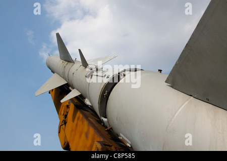 Soviet-built SA-2 GUIDELINE anti-aircraft missile in starting position, blue sky and clouds in background Stock Photo