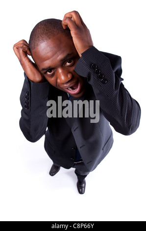 African businessman screaming with fear and a strange face expression (isolated on white) Stock Photo