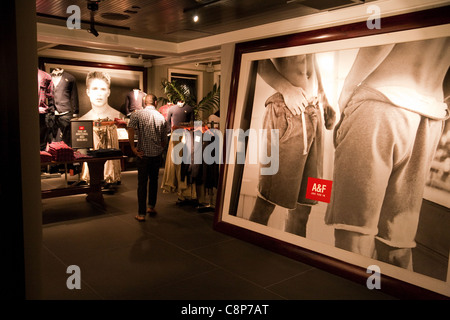 Young man in the Abercrombie and Fitch clothes store, Pentagon City Mall, Washington DC USA Stock Photo