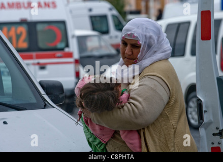 TheEarthquake epicenter in Tabanlı Village and measured 7.2 on the Richter scale struck Van Province, at 13:41 on 23 October 2011. The quake and its aftershocks were mostly felt in the regions surrounding the epicenter. A mother carries her injured daughter to the Red Cross hospital in the city of Stock Photo