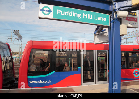 DLR train at Pudding Mill Lane station and the London 2012 Olympic Athletics Stadium in Stratford, East London. Oct 2011 Stock Photo