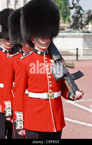 Foot Guards with machine guns on Parade outside Buckingham Palace, London, United Kingdom. Stock Photo