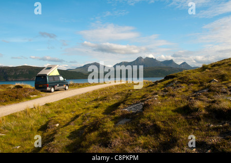 Ben Loyal over the Kyle of Tongue, Sutherland, Scotland, UK.  A Mazda Bongo Friendee campervan in the foreground. Stock Photo