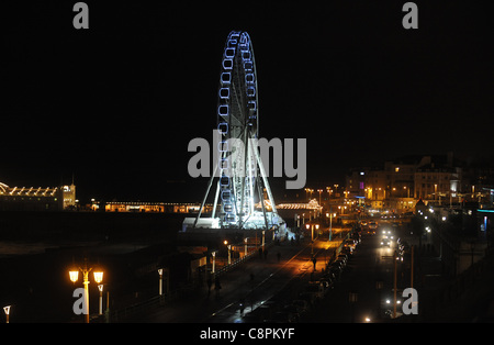 Brighton's new seafront attraction The Wheel of Excellence lit up at night UK Stock Photo