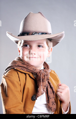 A young cowboy child raising a fist to fight Stock Photo