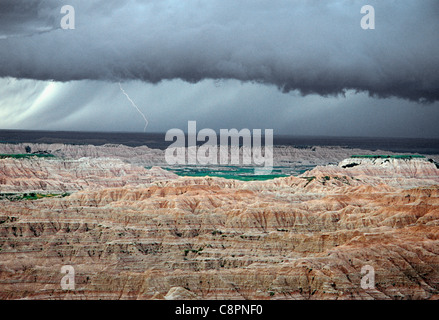 Lightning bolt and storm above sedimentary formations, North Unit, Badlands National Park, South Dakota, USA Stock Photo