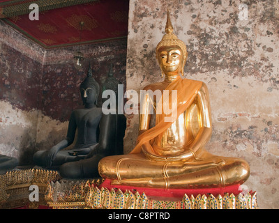 Buddha statues at Wat Suthat, temple in Bangkok Thailand Stock Photo