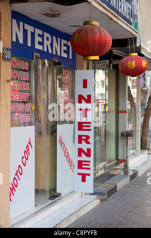 Internet cafe with red chinese lanterns outside Stock Photo