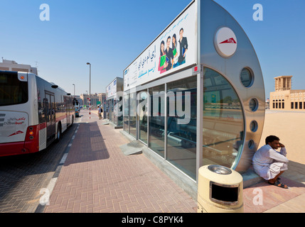 Air conditioned bus stop and shelter with bus in Dubai Dubai UAE United Arab Emirates Middle East Stock Photo