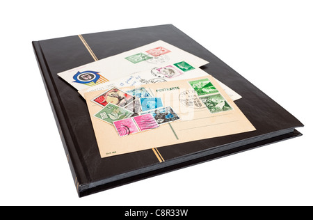 Album of postage stamps isolated on white background Stock Photo