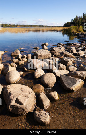 Boulders and rocks at the Mississippi headwaters on Lake Itasca in northern Minnesota. Stock Photo