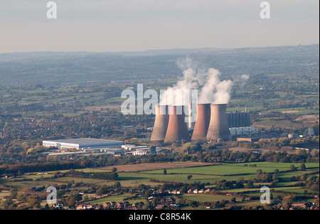 Aerial view Rugeley Power Station Staffordshire with Cooling Towers steaming.and Amazon Fulfilment Centre to the left Stock Photo