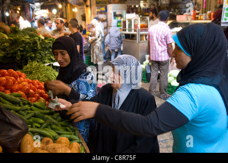 Fruit and vegetable shopping in the souk, old city, Tripoli (Trablous), northern Lebanon. Stock Photo