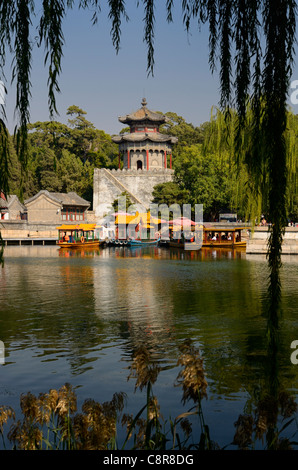 Dragon boat ferries docked at the Gate Tower of Cloud Retaining Eaves on Kunming Lake at Summer Palace Beijing China Stock Photo