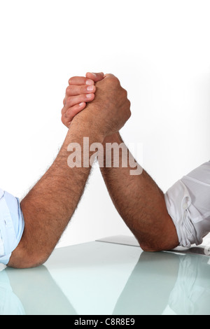arm wrestling between males Stock Photo