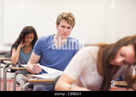 Students working on an assignment Stock Photo