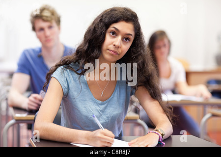 Focused student taking notes Stock Photo