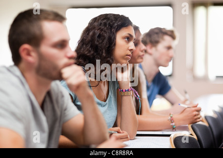 Students listening a lecturer Stock Photo