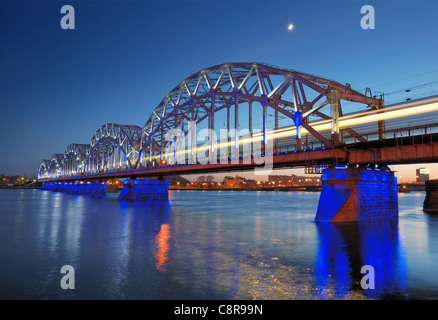 The railway riveted bridge across Daugava river in Riga, Latvia. Stock Photo