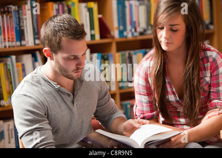 Young students reading a book Stock Photo