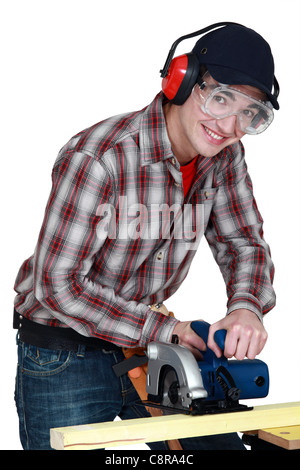 Man using a circular saw Stock Photo