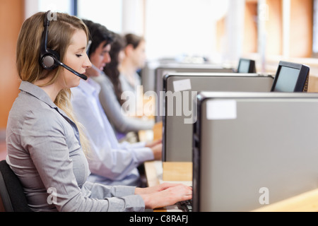 Operators using a computer in call center Stock Photo