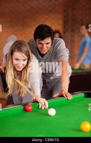 Portrait of a couple playing snooker Stock Photo