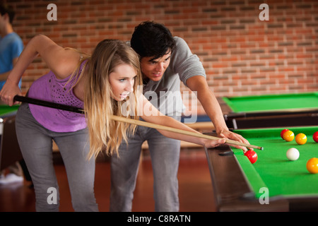 Young couple playing snooker Stock Photo