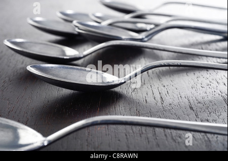 silver spoon on table Stock Photo