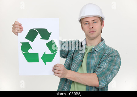 A construction worker promoting recycling. Stock Photo