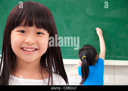happy asian student girls at school classroom Stock Photo