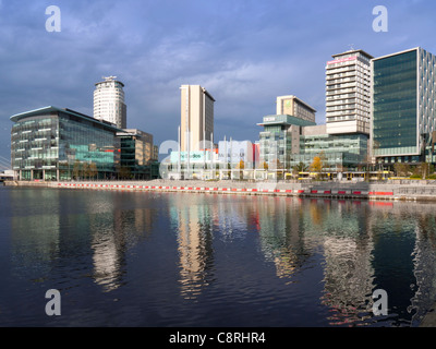 MediaCity, Salford Quays, Manchester across water, with tram Stock Photo