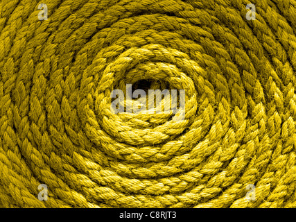 Heavy duty yellow coiled ships rope Stock Photo