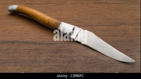 Knife on wooden background Stock Photo