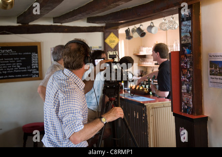 BBC cameraman reports on community pub purchase, Sorrel Horse, Shottisham, Suffolk, England Stock Photo