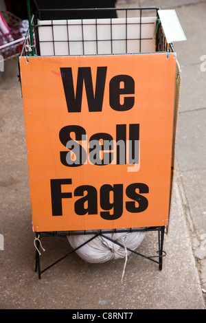 A sign advertising 'We Sell Fags' outside a shop in Blackpool, UK Stock Photo