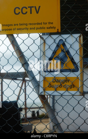 Guard dogs and CCTV warning sign. Stock Photo