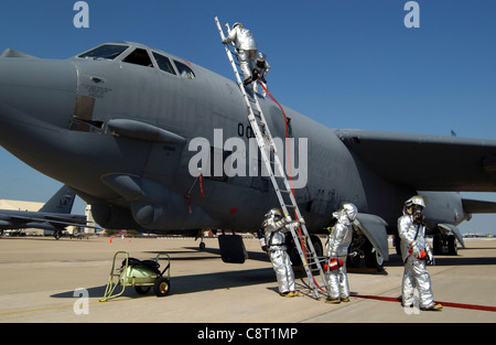 BARKSDALE AIR FORCE BASE, La. -- Firefighters prepare to remove a crew from a B-52 Stratofortress during an exercise here April 2. The firefighters are assigned to the 2nd Civil Engineer Squadron. Stock Photo