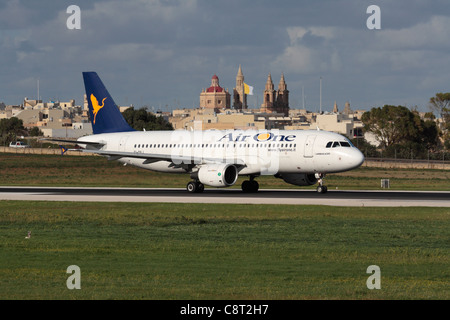 Air One Airbus A320 taxiing for departure from Malta Stock Photo
