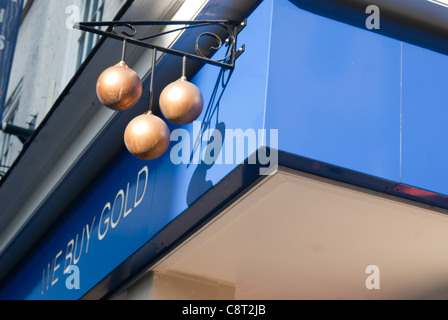 The three balls sign of the pawnbrokers shop Stock Photo