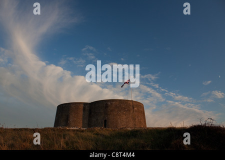 Clouds at dusk at the Slaughden Martello Tower, Aldeburgh, Suffolk Stock Photo