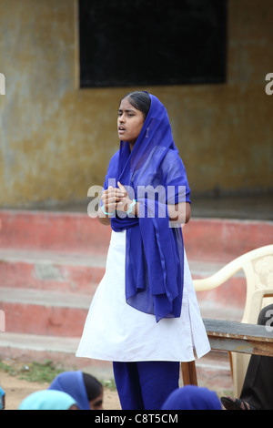 Muslim girl chanting at school Andhra Pradesh South India Stock Photo