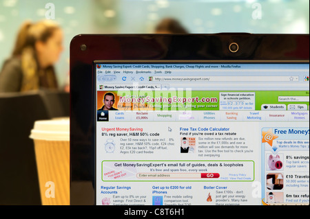Money Saving Expert website shot in a coffee shop environment (Editorial use only: print, TV, e-book and editorial website). Stock Photo