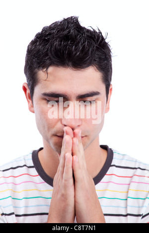 Young man praying (isolated on white) Stock Photo