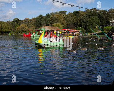 dh Peasholm Park SCARBOROUGH NORTH YORKSHIRE People in paddle boat on Peasholm lake boats uk Stock Photo