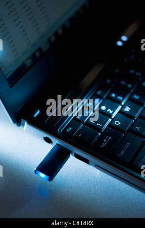 Studio shot of flash drive in laptop Stock Photo