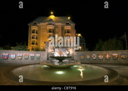 Confederation Garden Court Fountain in Victoria BC Canada with Code of Arms at Night Stock Photo