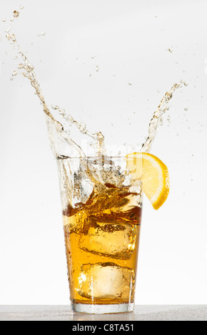 Studio shot of iced tea with splash Stock Photo