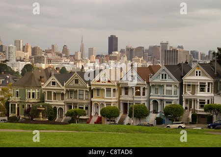 Painted Ladies Row Houses by Alamo Square with San Francisco Skyline Stock Photo