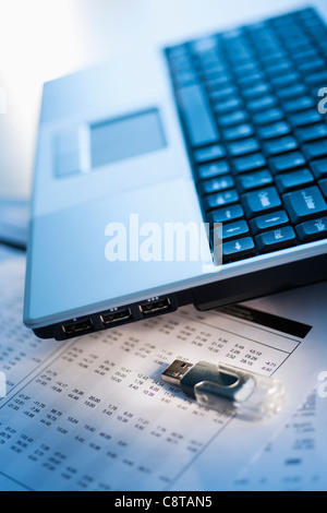 Studio shot of laptop with memory stick Stock Photo